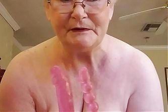 Horny Granny strips for you and shows her huge tits shaking.